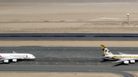 Etihad and Emirates Airbus A380s lineup.