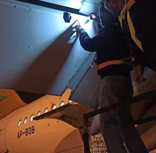 Airbus A320 being inspected by Air Sial engineers